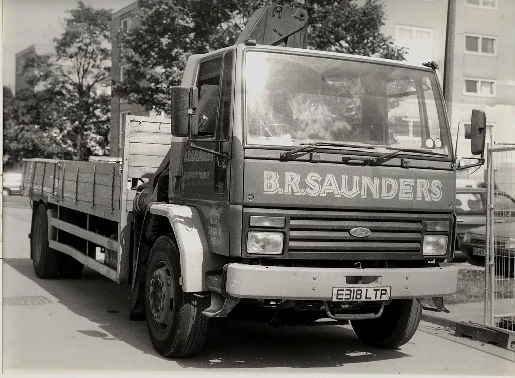 A black and white photo of a truck.