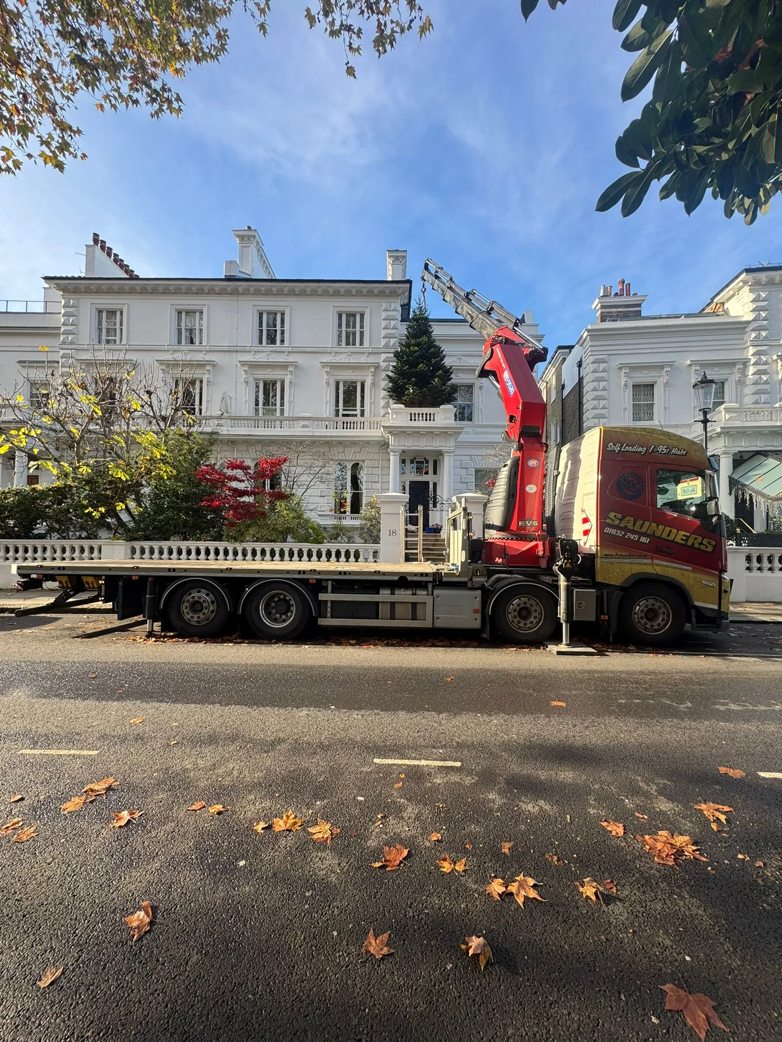 A large truck with a crane on the back of it.