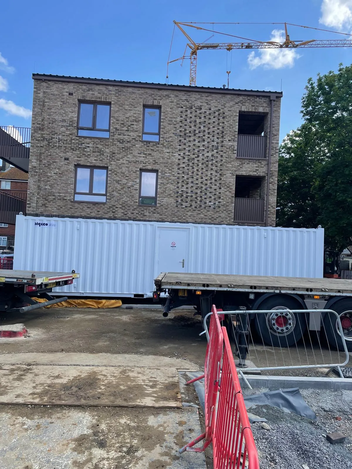 A truck is parked in front of a building.